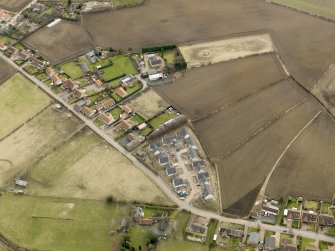 Oblique aerial view centred on the east end of the village, taken from the NW.
