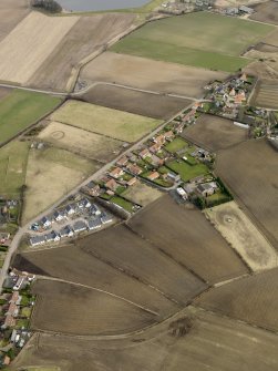 Oblique aerial view centred on the east end of the village, taken from the SW.