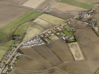 Oblique aerial view centred on the east end of the village, taken from the SW.