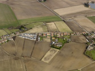 SOblique aerial view centred on the east end of the village, taken from the SSW.