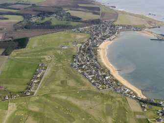 General oblique aerial view centred on the golf course with the villages adjacent, taken from the SW.