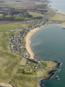 General oblique aerial view centred on the villages with golf course adjacent, taken from the SW.