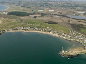 General oblique aerial view centred on the villages with the golf course and harbour adjacent, taken from the SSE.