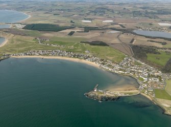 General oblique aerial view centred on the villages with the golf course and harbour adjacent, taken from the SE.