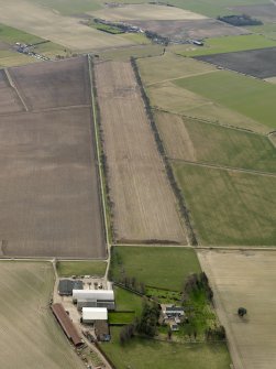 General oblique aerial view centred on the remains of the avenue with the country house adjacent, taken from the N.