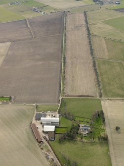 General oblique aerial view centred on the remains of the avenue with the country house adjacent, taken from the N.