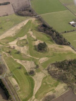 Oblique aerial view centred on the golf course with the dovecot adjacent, taken from the W.