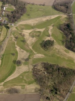 Oblique aerial view centred on the golf course with the dovecot, lodge and stable adjacent, taken from the WSW.