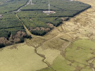 Oblique aerial view centred on the remains of rig and furrow cultivation, taken from the E.