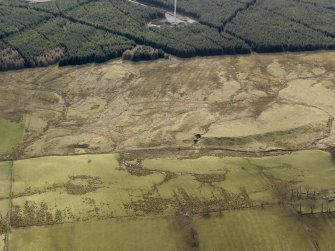 Oblique aerial view centred on the remains of rig and furrow cultivation, taken from the N.