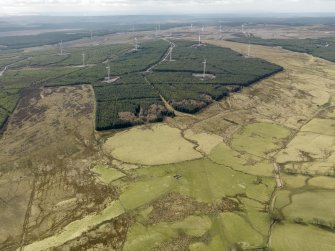 Oblique aerial view centred on the windfarm with areas of rig and furrow cultivation adjacent, taken from the NE.