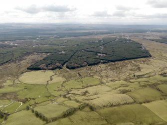 Oblique aerial view centred on the windfarm with areas of rig and furrow cultivation adjacent, taken from the NNE.