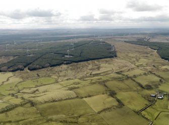 Oblique aerial view centred on the windfarm with areas of rig and furrow cultivation adjacent, taken from the NNE.