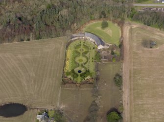 Oblique aerial view centred on the walled garden and estate cottage, taken from the S.