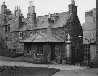 EPS/5/2  Photograph of entrance gates and lodge to churchyard, with text;'Greyfriars Chruchyard East Division  Entrance - General view showing gateway from Forrest Road'
Edinburgh Photographic Society Survey of Edinburgh and District, Ward XIV George Square