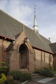 Detail of Entrance to Church showing spire.