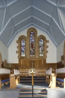 Interior. General view of altar and stained glass window.