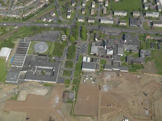 Oblique aerial view centred on St Augustine's High and Forrester Secondary Schools, taken from the WSW.