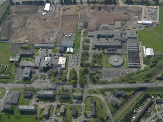 Oblique aerial view centred on St Augustine's High and Forrester Secondary Schools, taken from the  ENE.