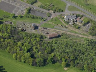 Oblique aerial view centred on the Mining Museum, taken from the SE.