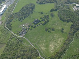 Oblique aerial view centred on the remains of the castle, taken from the NE.