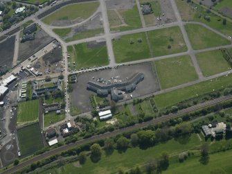 Oblique aerial view centred on Craigmiller Primary School, taken from the NNE.