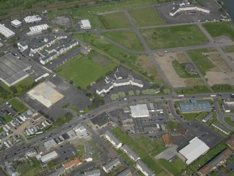 Oblique aerial view centred on St Francis' School, taken from the SSW.