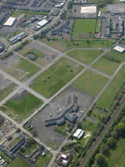 General oblique aerial view centred on Craigmiller Primary School with the St Francis' School adjacent, taken from the NE.