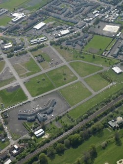 General oblique aerial view centred on Craigmiller Primary School with St Francis' School adjacent, taken from the NE.