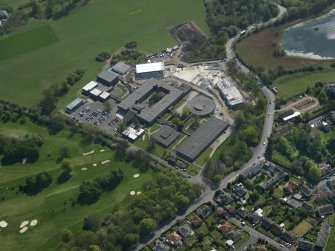 Oblique aerial view centred on the school, taken from the NE.
