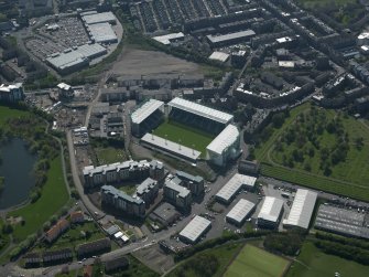 Oblique aerial view centred on the football stadium, taken from the SW.