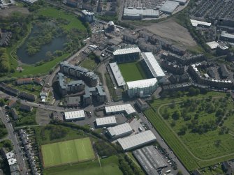 Oblique aerial view centred on the football stadium, taken from the N.