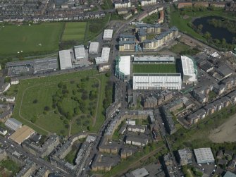 Oblique aerial view centred on the football stadium, taken from the SW.