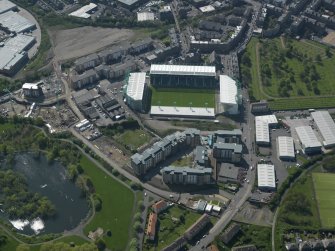 Oblique aerial view centred on the football stadium, taken from the ENE.