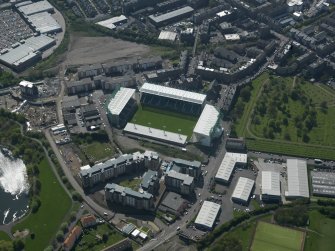 Oblique aerial view centred on the football stadium, taken from the NE.