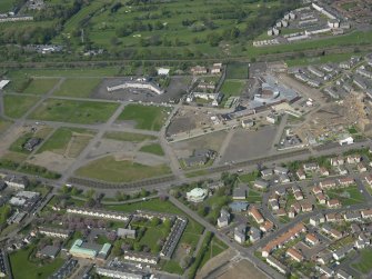 General oblique aerial view centred on the former (now demolished) housing estate of Niddrie Mains, taken from the SSE.