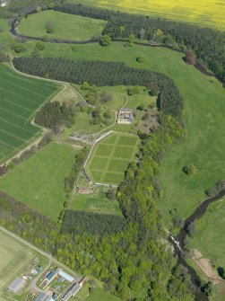 Oblique aerial view centred on the walled garden with the stable block adjacent, taken from the SSW.