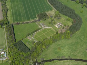 Oblique aerial view centred on the walled garden with the stable block adjacent, taken from the SSW.