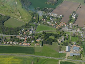 Oblique aerial view centred on the village with the castle adjacent, taken from the SSE.