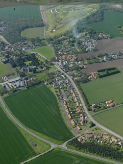 General oblique aerial view centred on the village with the castle adjacent, taken from the E.