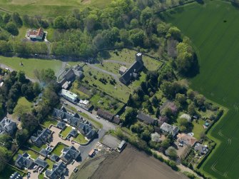 Oblique aerial view centred on the parish church with the church hall adjacent, taken from the NE.