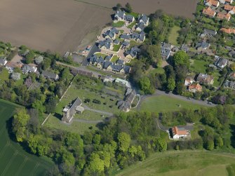 Oblique aerial view centred on the parish church with the church hall adjacent, taken from the WSW.