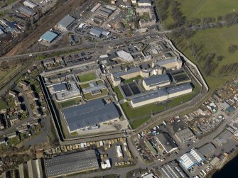 Oblique aerial view centred on the prison, taken from the SE.