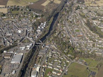 Oblique aerial view of the town centred on the bridge with Rattray adjacent, taken from the SE.