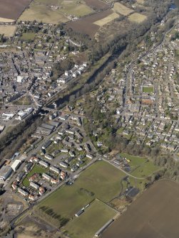 Oblique aerial view of the town centred on Rattray and the bridge with the town adjacent, taken from the SE.