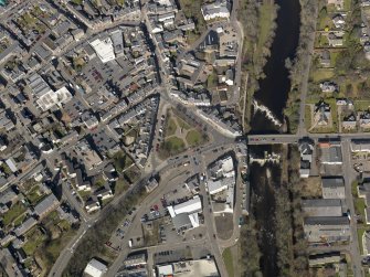 Oblique aerial view of the town centred on the bridge, taken from the SSE.