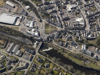 Oblique aerial view of the town centred on the bridge, taken from the NW.