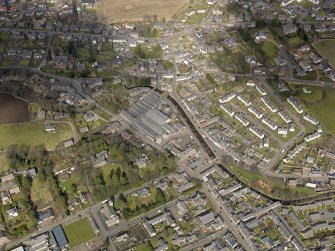 Oblique aerial view of the town centred on the carpet mill, taken from the S.