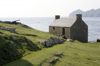 Village Bay, Feather Store. View from N looking down The Street to the rear of the storehouse, with the gun emplacement in the distance.