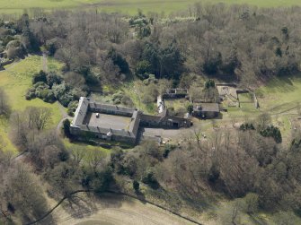 Oblique aerial view centred on the stable block, taken from the E.